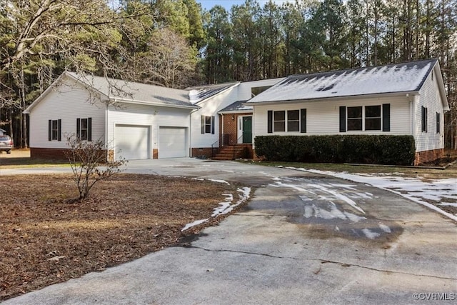 ranch-style house featuring a garage