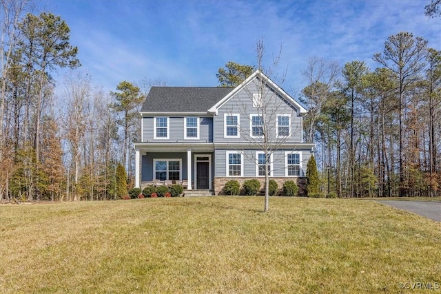 view of front of property featuring stone siding, a porch, and a front yard