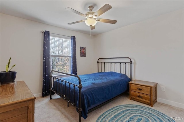 bedroom featuring carpet flooring, a ceiling fan, and baseboards