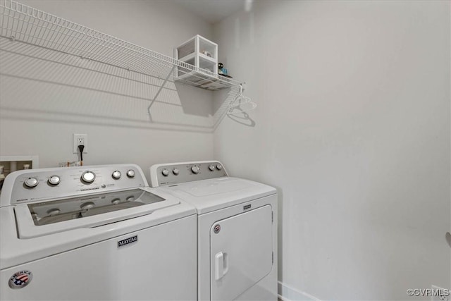 laundry area with laundry area and washing machine and clothes dryer