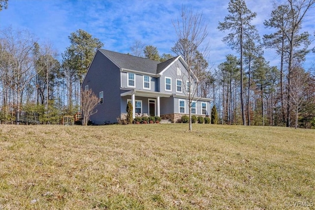 craftsman-style house featuring a porch, stone siding, and a front lawn