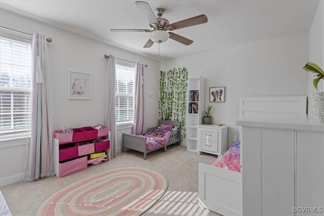 bedroom with carpet flooring, ceiling fan, and baseboards