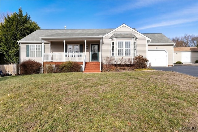 ranch-style home with a porch, a garage, and a front lawn