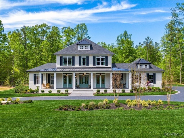 view of front facade with a porch and a front lawn