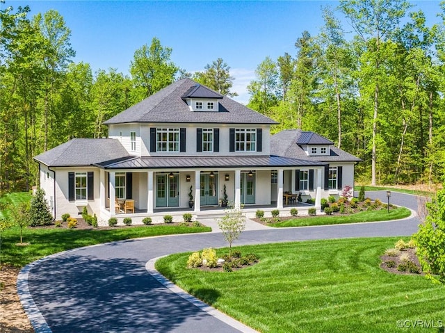 view of front of house featuring a porch and a front lawn