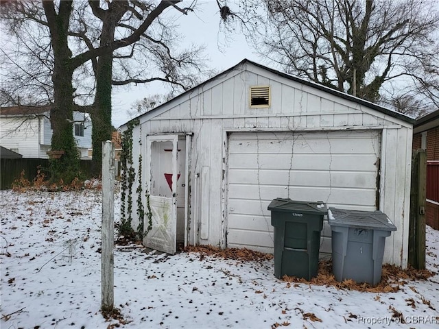 view of snow covered garage