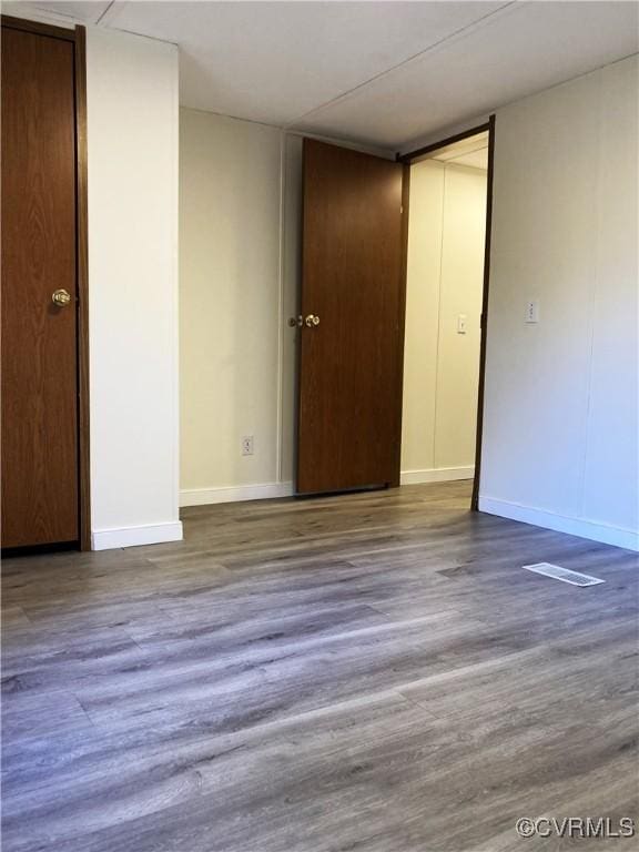 spare room featuring hardwood / wood-style flooring