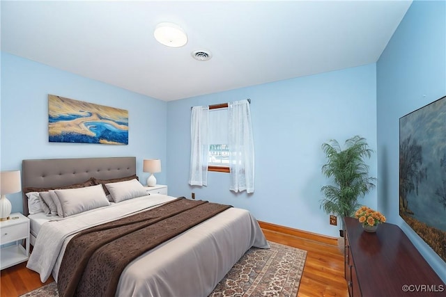 bedroom with light hardwood / wood-style flooring