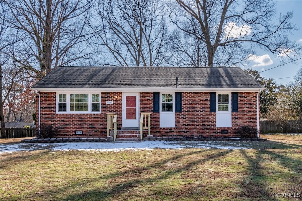 ranch-style home with a front yard