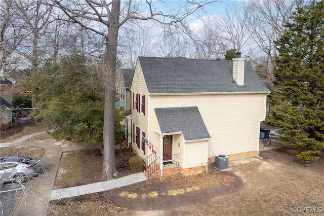 view of side of property featuring central AC unit