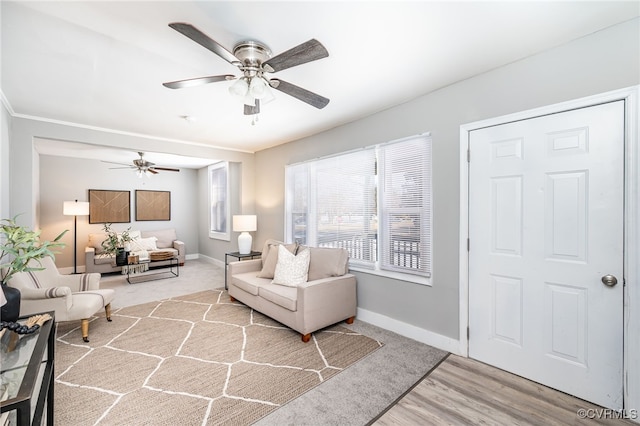 living room with ceiling fan and light wood-type flooring