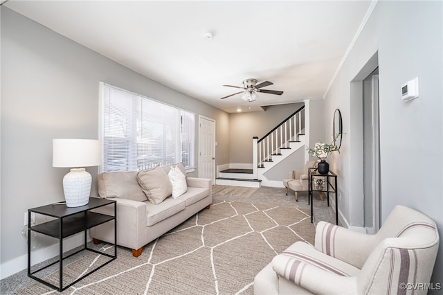 carpeted living room featuring ceiling fan