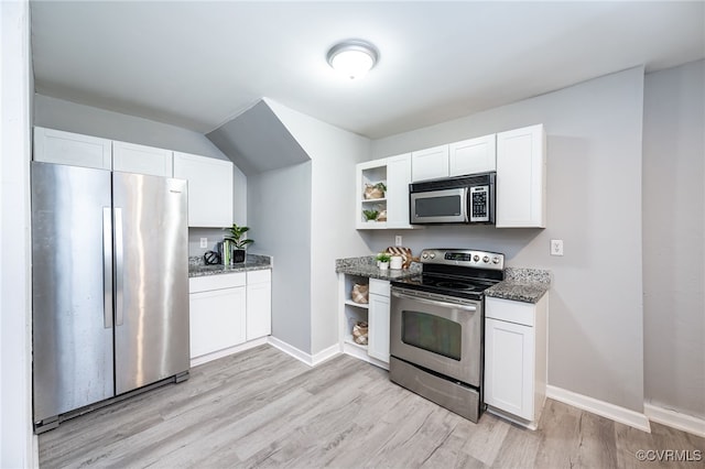 kitchen featuring white cabinetry, stainless steel appliances, light hardwood / wood-style flooring, and stone counters