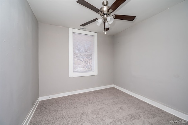 carpeted empty room featuring ceiling fan