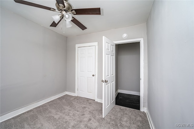 unfurnished bedroom with light colored carpet and ceiling fan