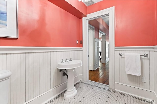 bathroom with tile patterned floors