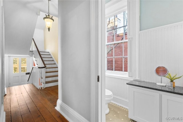 stairway with wood-type flooring