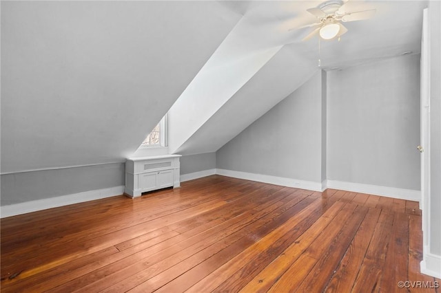 additional living space featuring lofted ceiling, wood-type flooring, and ceiling fan