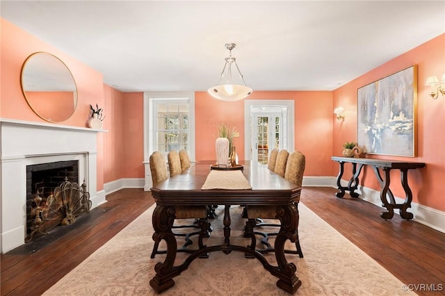 dining space with dark hardwood / wood-style floors