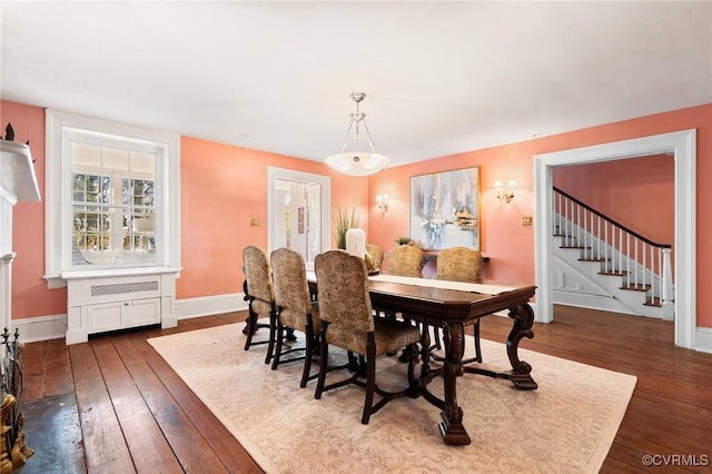 dining area with dark hardwood / wood-style floors