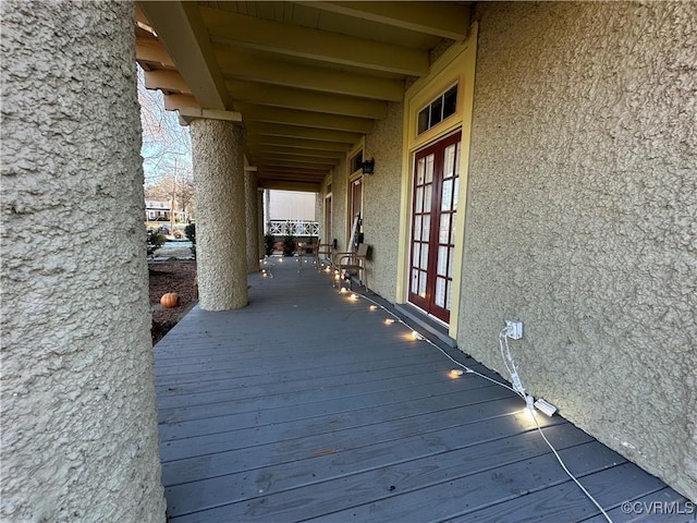 wooden deck featuring french doors