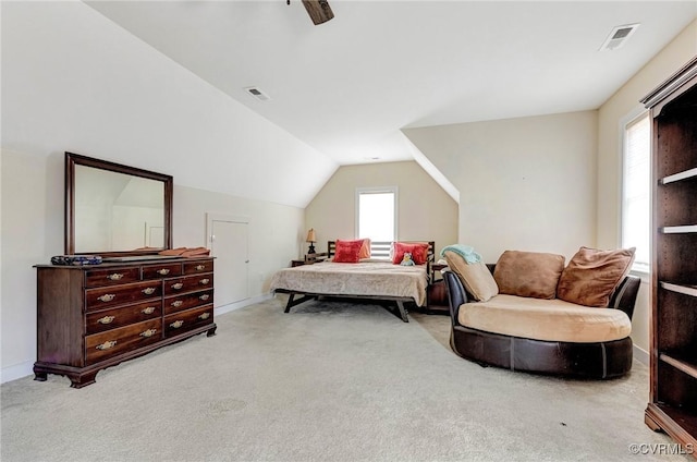 carpeted bedroom with ceiling fan and lofted ceiling