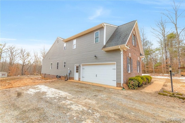 view of property exterior with a garage