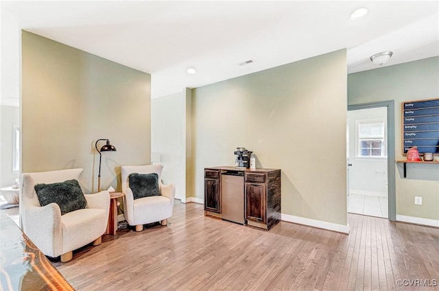 sitting room featuring light hardwood / wood-style flooring