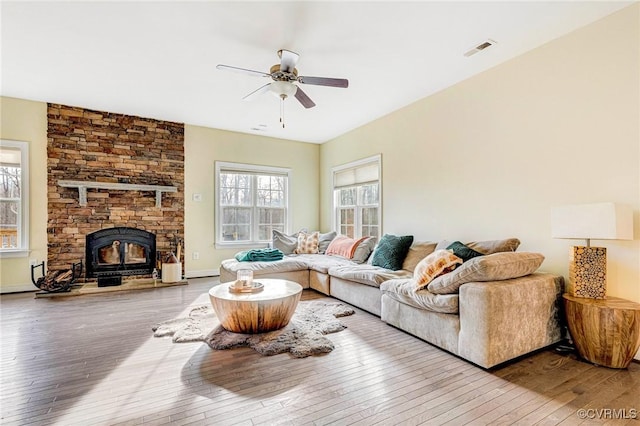 living room featuring hardwood / wood-style flooring and ceiling fan