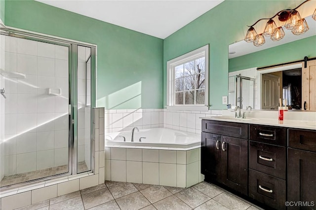 bathroom featuring tile patterned floors, separate shower and tub, and vanity