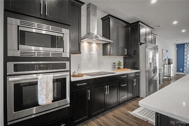 2616 Lassen Walk Unit B, Henrico, VA 23294 - kitchen featuring wall chimney range hood, stainless steel appliances, and dark cabinetry