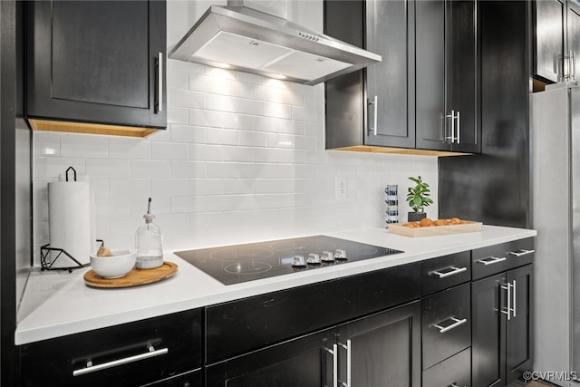 2616 Lassen Walk Unit B, Henrico, VA 23294 - kitchen featuring black electric cooktop, dark cabinetry, tasteful backsplash, and wall chimney exhaust hood