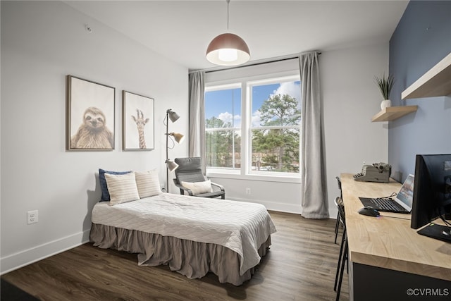 bedroom featuring dark hardwood / wood-style flooring