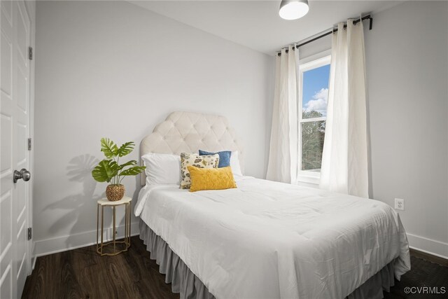 bedroom featuring dark wood-type flooring