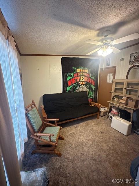 bedroom featuring carpet floors, a textured ceiling, and ceiling fan