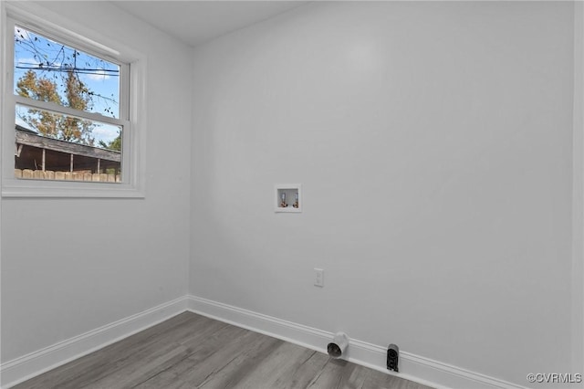 laundry room featuring washer hookup and hardwood / wood-style flooring