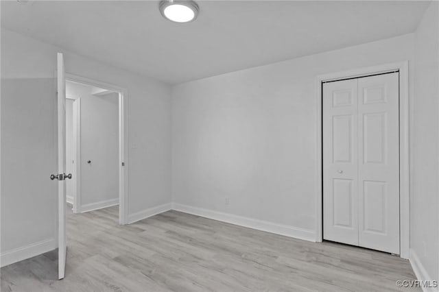 unfurnished room featuring light wood-type flooring