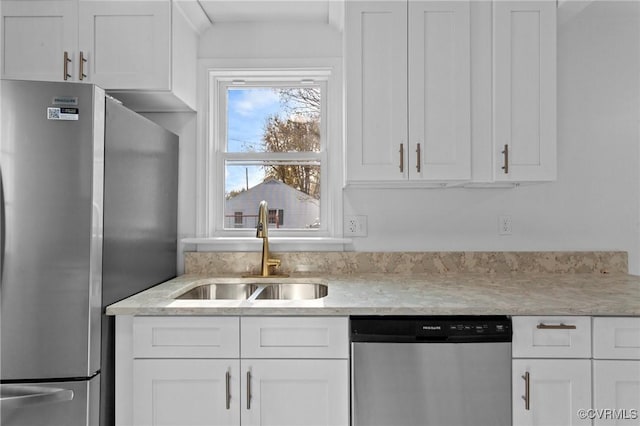 kitchen featuring white cabinetry, sink, and appliances with stainless steel finishes