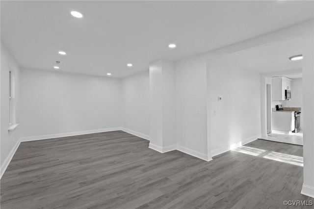 spare room with dark hardwood / wood-style floors