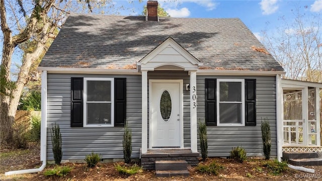 view of front of home featuring a sunroom