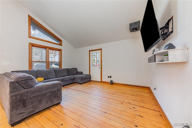 living room with lofted ceiling and hardwood / wood-style flooring