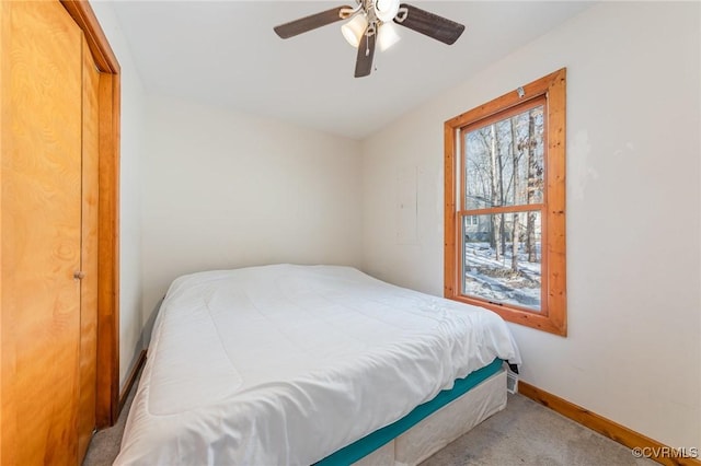 bedroom featuring light carpet and ceiling fan