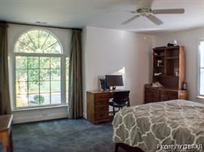 carpeted bedroom featuring ceiling fan