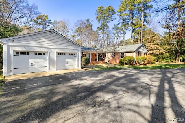 ranch-style home with a garage