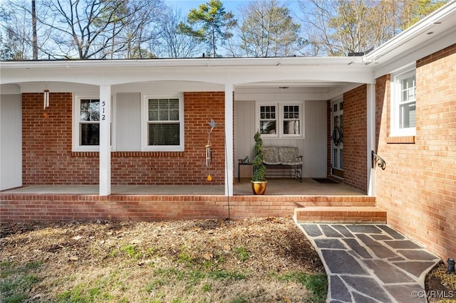 property entrance featuring a porch