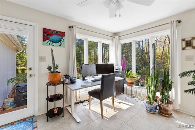 tiled office with ceiling fan and a wealth of natural light