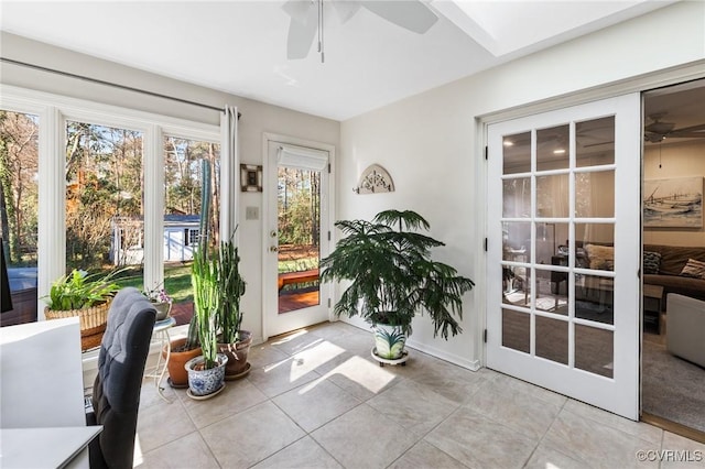 sunroom featuring ceiling fan