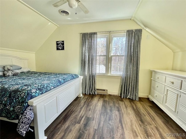 bedroom featuring a baseboard heating unit, lofted ceiling, dark wood-type flooring, and ceiling fan