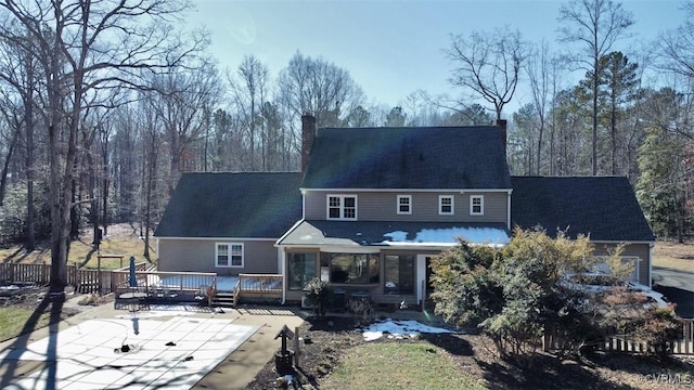 back of house with a deck and a patio area