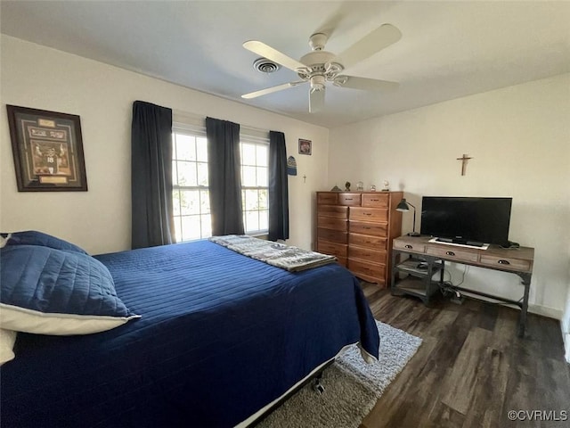 bedroom with dark wood-type flooring and ceiling fan